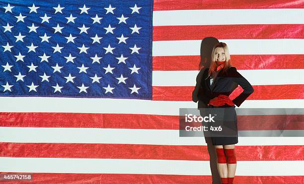 Smiling Businesswoman In Front Of American Flag Stock Photo - Download Image Now - 2015, 30-34 Years, 30-39 Years