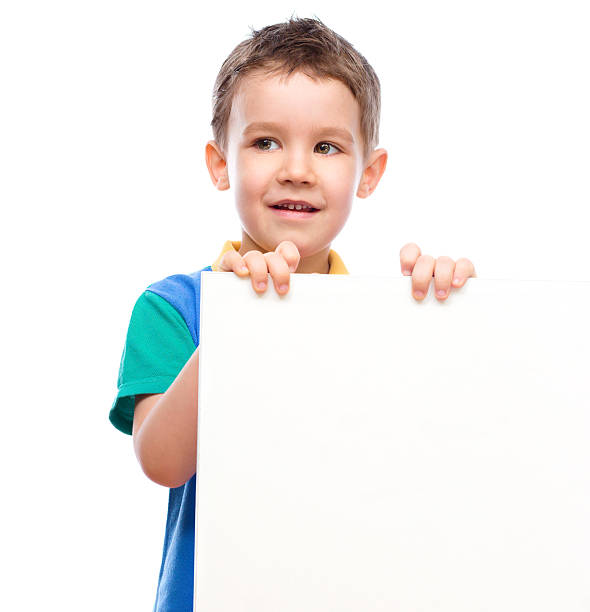 istock Cute boy is holding blank banner 465749432