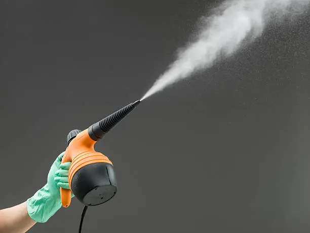 one person working with steam cleaner