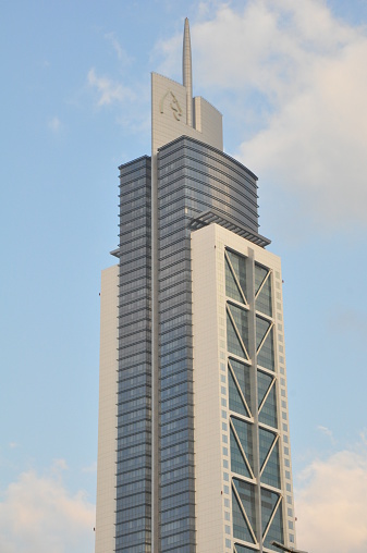 Dubai, UAE - February 20, 2014: Millennium Tower on Sheikh Zayed Road in Dubai, UAE. The tower rises 285 m (935 ft) and has 60 floors.