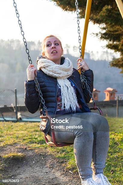 Young White Girl Play On A Swing Color Image Stock Photo - Download Image Now - 2015, Adolescence, Adult