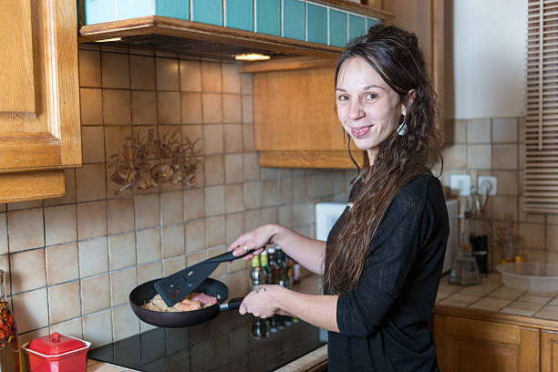 istock young woman in her kitchen 465752678