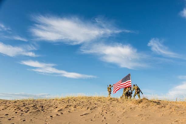 istock WW2 Soldiers Raising the Flag 465755742