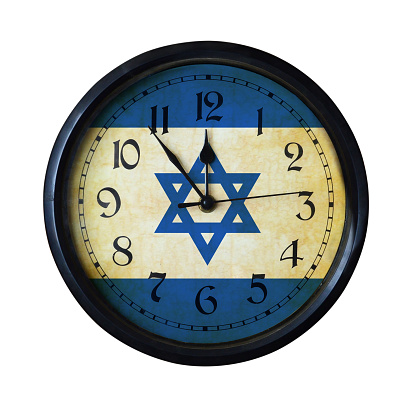 An old Israel flag wall clock with grungy background - isolated over white.
