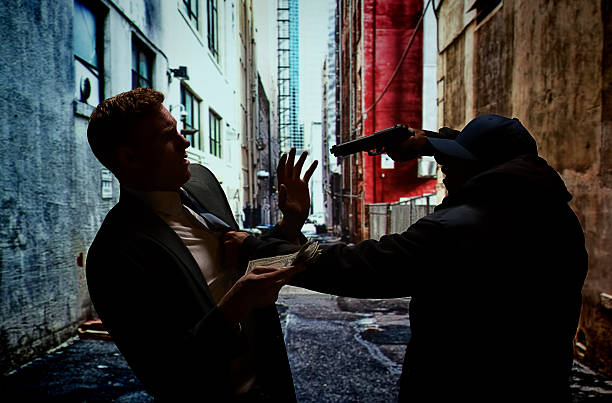 istock Robber robbing from the businessman 465757084