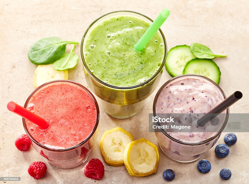 glasses of various smoothies glasses of various smoothies with straws for healthy dieting breakfast 2015 Stock Photo