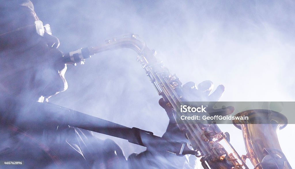 African jazz musician playing the saxophone African jazz musician playing the saxophoneAfrican jazz musician playing the saxophone Saxophonist Stock Photo