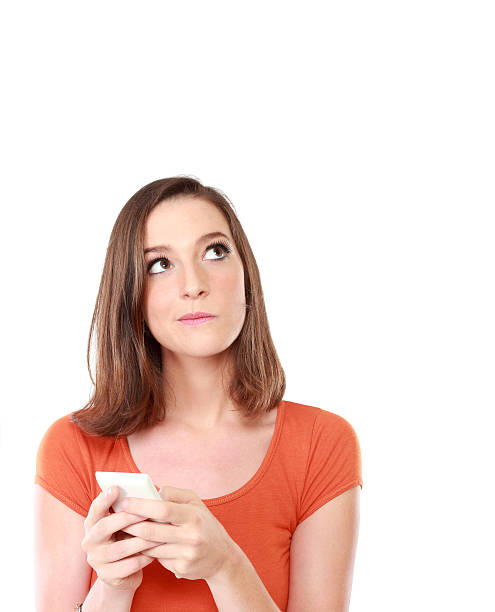 istock girl with mobile phone looking up to blank space 465769428