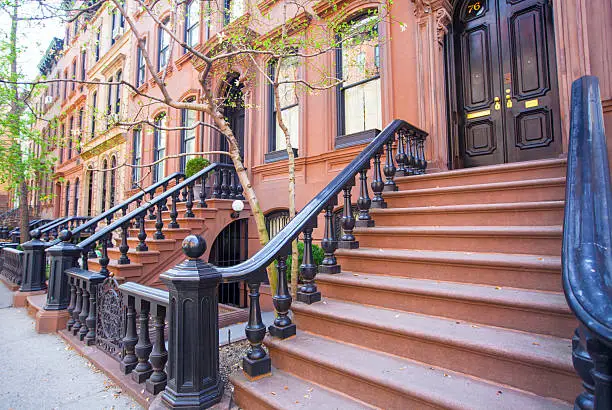 Photo of Old houses with stairs in historic district of West Village