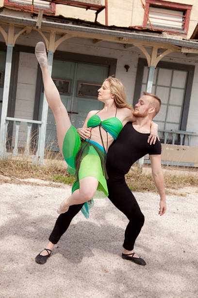 istock Man, woman acrobats perform outdoors. Leotards, costume. Dancers 465777742