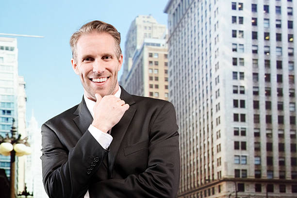 istock Smiling businessman outdoors in the city 465778172