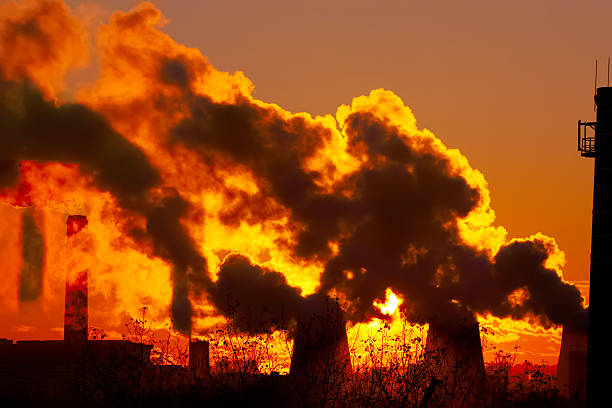 istock power plant smokestacks at sunset 465778406