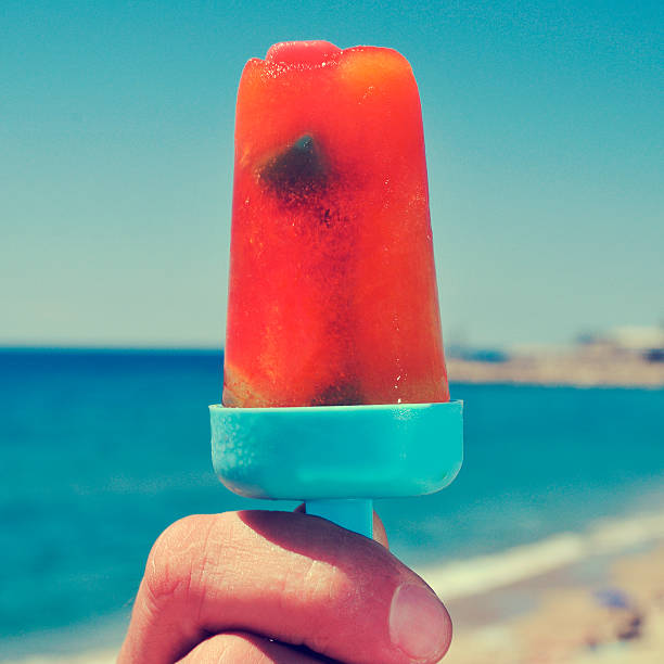 istock homemade ice pop on the beach, with a filter effect 465781206