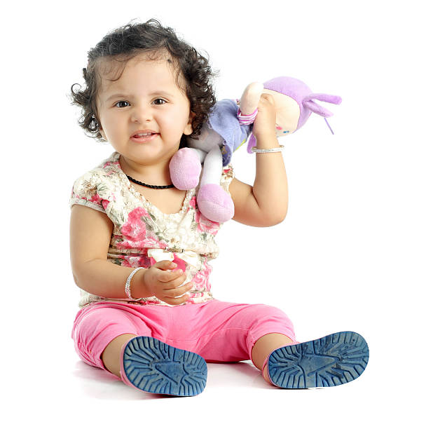 istock Baby girl with a colored soft toy 465781402