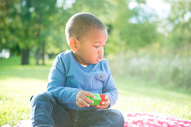 istock Baby boy playing by himself 465781618