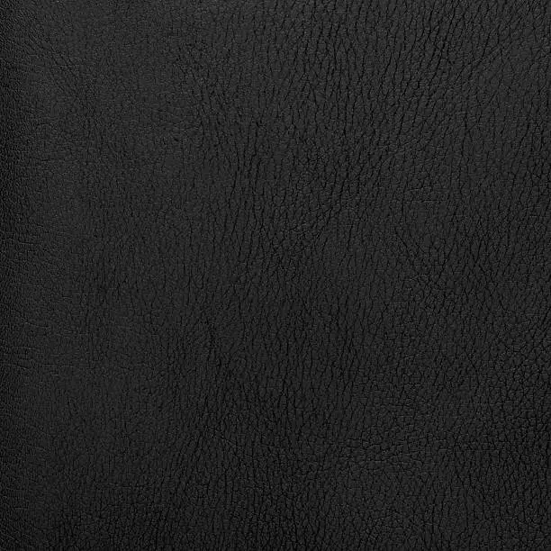 Natural qualitative black leather texture. Close up.