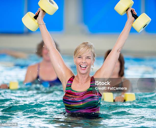 Excited Seniors Water Aerobics Stock Photo - Download Image Now - 2015, 60-69 Years, Active Lifestyle
