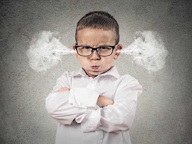 Angry upset boy, little man Closeup portrait Angry young Boy, Blowing Steam coming out of ears, about have Nervous atomic breakdown, isolated grey background. Negative human emotions, Facial Expression, feeling attitude reaction anger stock pictures, royalty-free photos & images