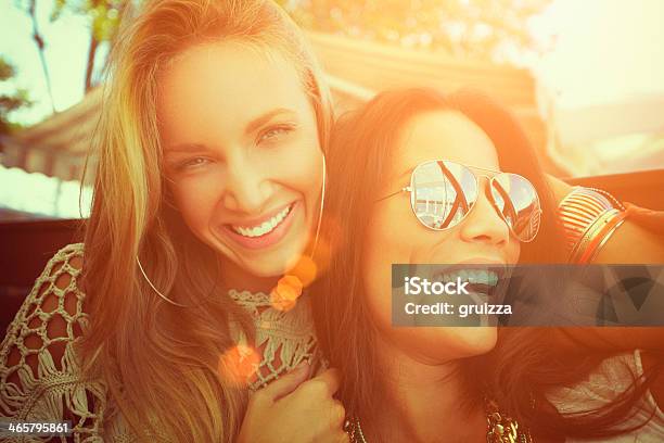 Closeup Of Two Cheerful Friends Having Fun At A Cafe Stock Photo - Download Image Now