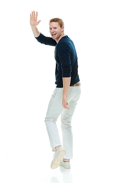 istock Cheerful casual man waving hand 465797660