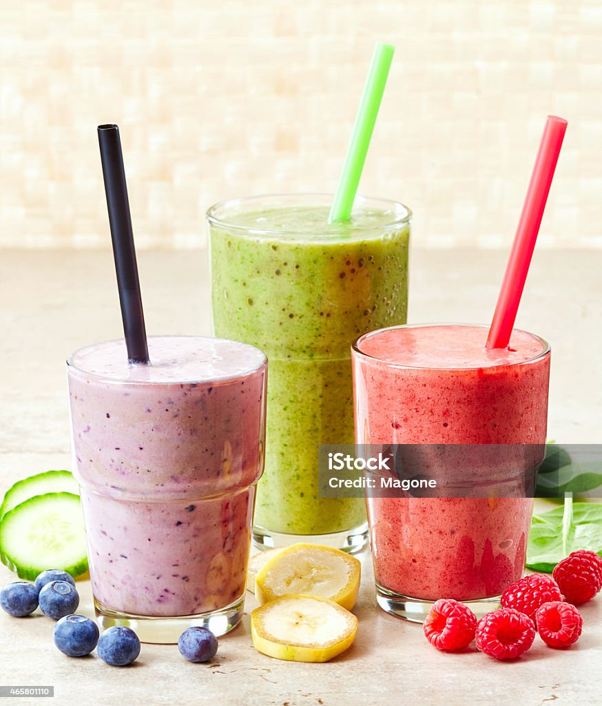 glasses of various smoothies glasses of various smoothies with straws for healthy dieting breakfast 2015 Stock Photo