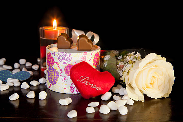 istock Romantic Candle light with shaped heart chocolate 465807315