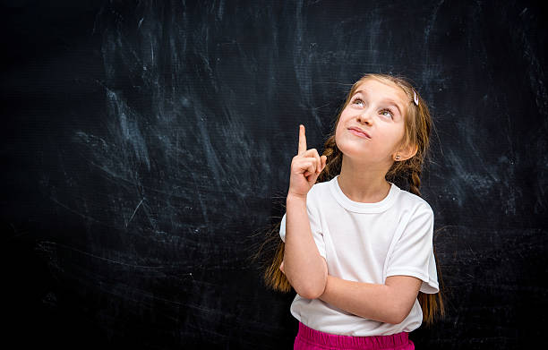 istock little girl with the idea 465813114