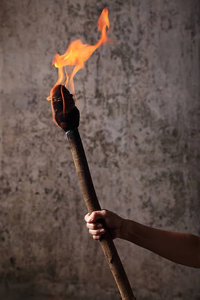Holding a Flaming Torch stock photo