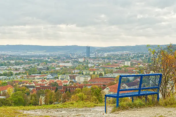 View to the city of Jena with Intershop tower, the typical landmark of university city Jena, Thuringia, Germany. In the foreground "Heiligenberg" (holy hill)