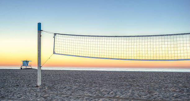 Beach Volleyball at Sunrise stock photo