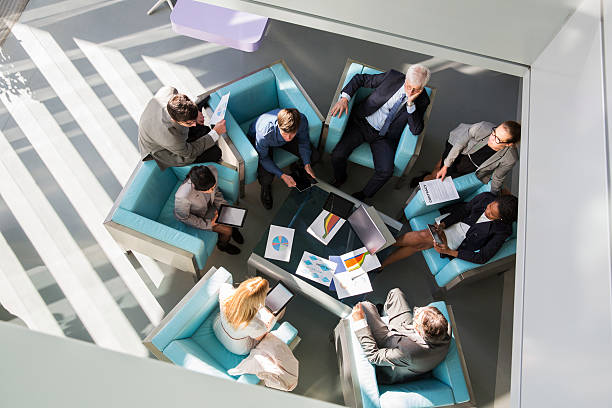 istock Group of ofiice worker sitting in lobby,discussing 465825472