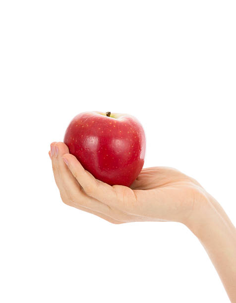istock Close up of hand holding a red apple 465825864