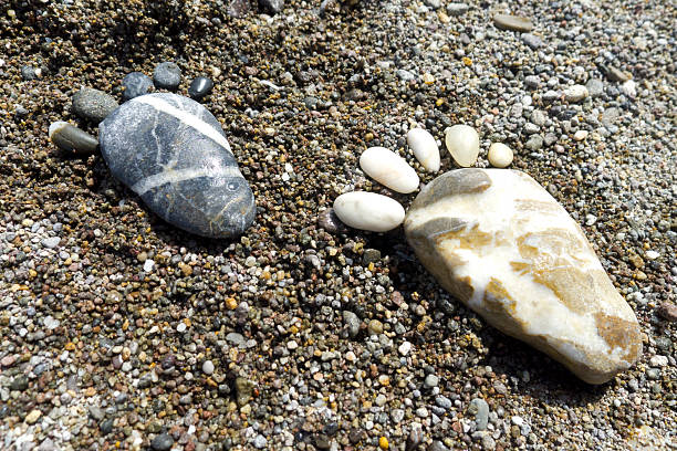 istock foot prints of stones 465827258