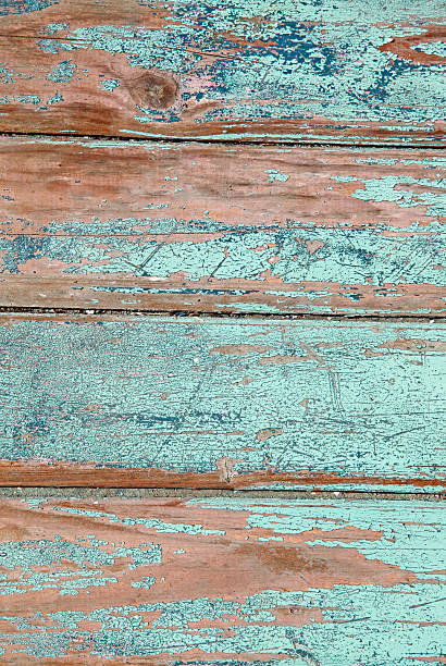 istock Weathered old wood natural blue turquoise paint peeling planks background 465829693
