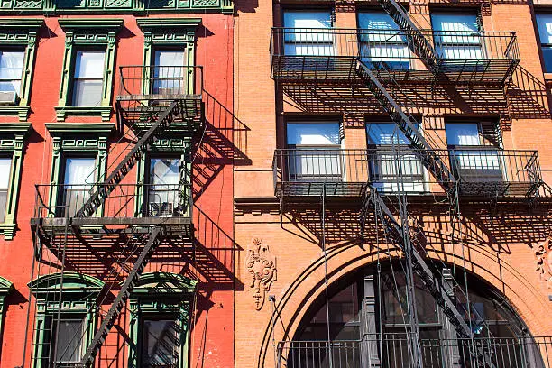 Photo of Old houses with stairs in historic district of West Village