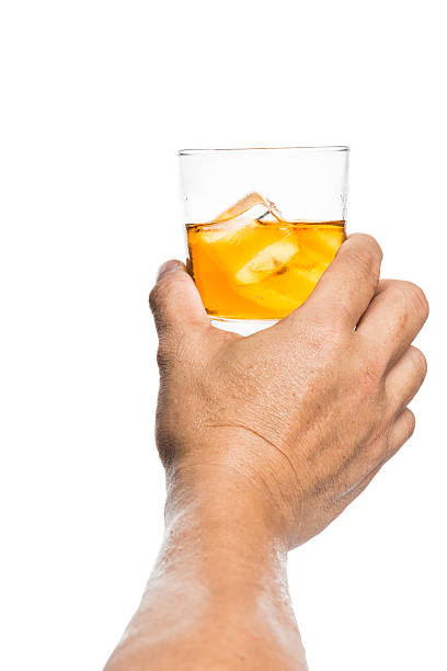 istock Hand toasting scotch brandy on the rock with white background 465836816