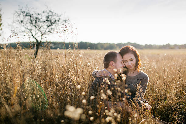 istock Young couple hugging at sunset 465840412