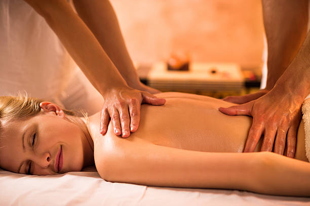 istock Woman receiving back massage. 465840932