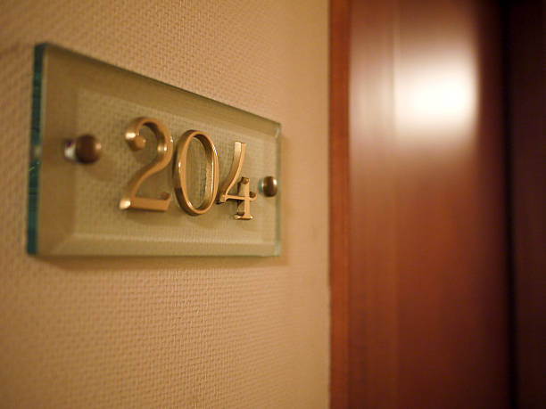 istock Room number placard outside hotel room 465842539