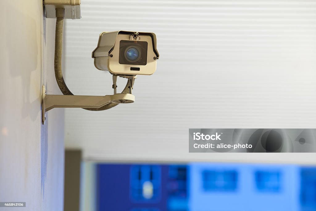 Security, CCTV camera for office building at night Security, CCTV camera for office building at night in London. 2015 Stock Photo