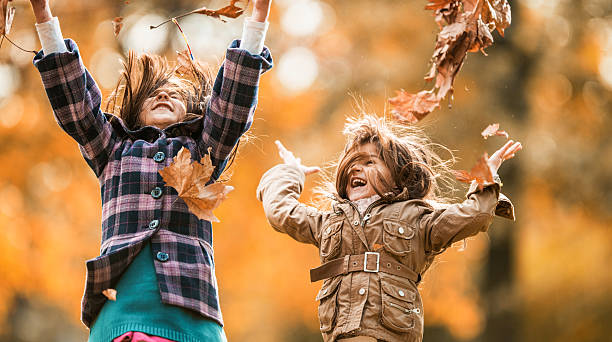 istock Little girls having fun in autumn. 465843538