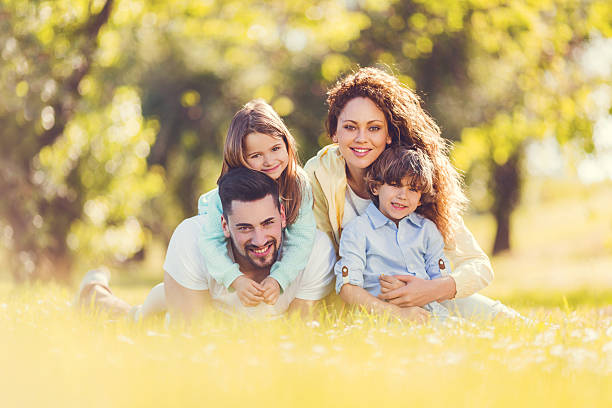 istock Happy young family in grass. 465844084