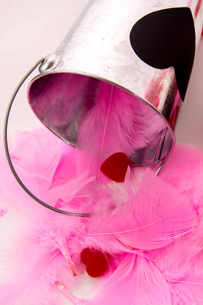 istock Valentines Day - decorations, pink feathers and heart shaped can 465844456