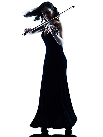 one caucasian Violinist woman player playing violon studio slihouette isolated in white background