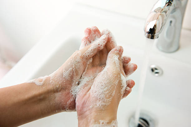 istock Person washing their hands in sink 465846749