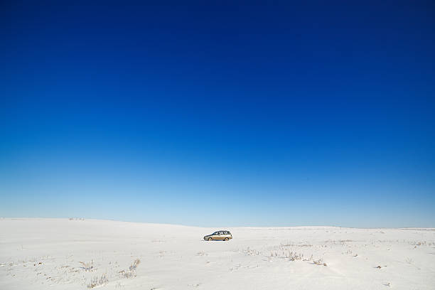 istock Traveler car on snow-covered road. 465848574
