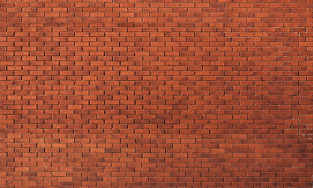 Brick Wall, Modern Modern red brick wall in gentle sunshine, full frame for texture use. brick stock pictures, royalty-free photos & images
