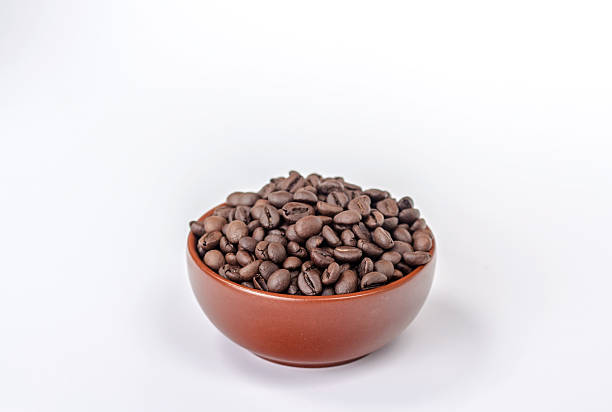 istock bowl full of coffee beans isolated on white backgrond 465853582