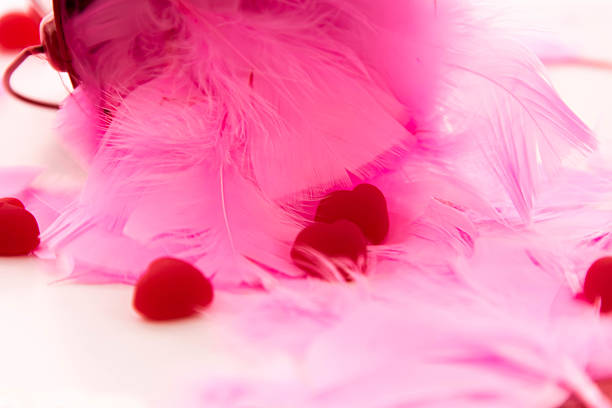 istock Valentines Day - decorations, pink feathers and heart shaped can 465853848