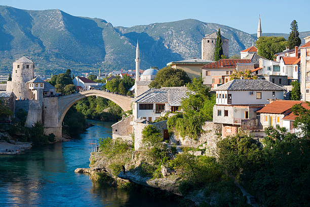 Old Bridge over Neretva River in Mostar, Bosnia and Herzegovina The Old Bridge over the Neretva River in Mostar, Bosnia and Herzegovina. The 16th-century bridge, destroyed during the war in 1993, was reconstructed in 2004. bosnia and herzegovina stock pictures, royalty-free photos & images